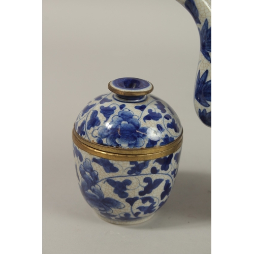 1272 - A CHINESE BLUE AND WHITE PORCELAIN PIERCED CENTRE TEAPOT, together with associated pair of lidded po... 