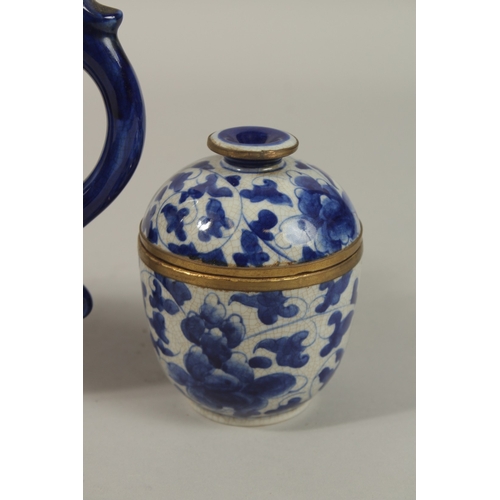 1272 - A CHINESE BLUE AND WHITE PORCELAIN PIERCED CENTRE TEAPOT, together with associated pair of lidded po... 