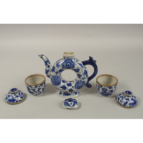 1272 - A CHINESE BLUE AND WHITE PORCELAIN PIERCED CENTRE TEAPOT, together with associated pair of lidded po... 