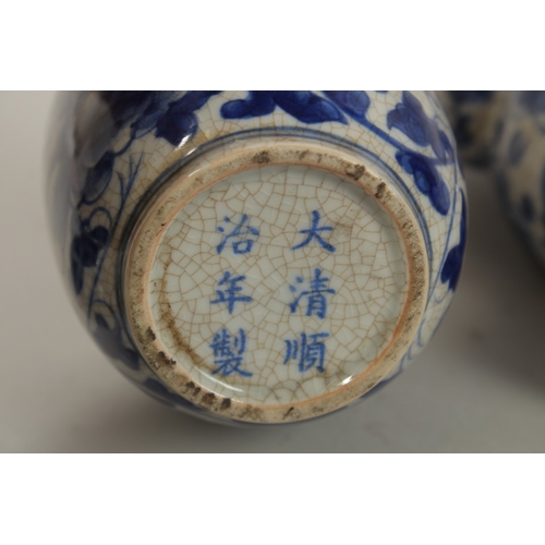 1272 - A CHINESE BLUE AND WHITE PORCELAIN PIERCED CENTRE TEAPOT, together with associated pair of lidded po... 