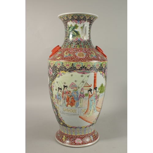 1278 - A LARGE CHINESE FAMILLE NOIR / ROSE PORCELAIN VASE, with twin bat formed handles, painted with two l... 