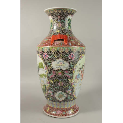 1278 - A LARGE CHINESE FAMILLE NOIR / ROSE PORCELAIN VASE, with twin bat formed handles, painted with two l... 