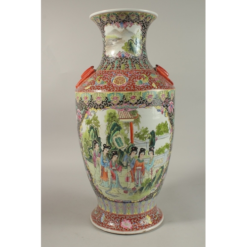 1278 - A LARGE CHINESE FAMILLE NOIR / ROSE PORCELAIN VASE, with twin bat formed handles, painted with two l... 