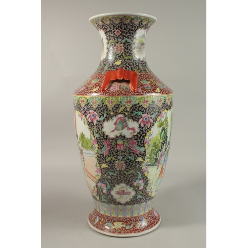 1278 - A LARGE CHINESE FAMILLE NOIR / ROSE PORCELAIN VASE, with twin bat formed handles, painted with two l... 