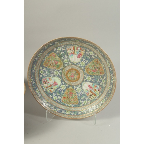 1278A - A VERY LARGE CHINESE BLUE GROUND FAMILLE ROSE PORCELAIN PUNCH BOWL AND UNDER-PLATE, enamel painted w... 