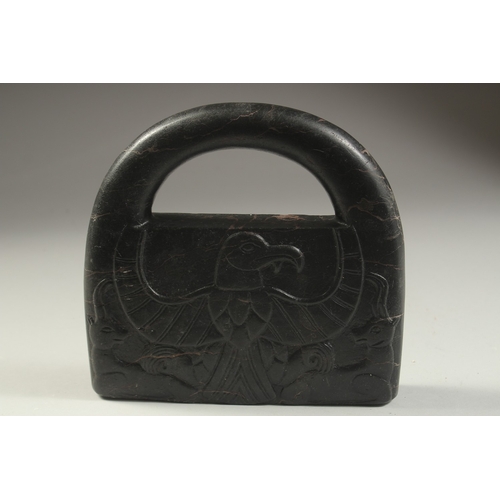 1279 - A CARVED STONE HANGING WEIGHT, 20cm x 19cm.