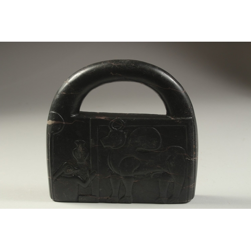 1279 - A CARVED STONE HANGING WEIGHT, 20cm x 19cm.