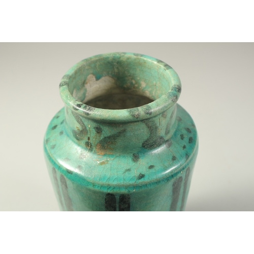 1280 - A PERSIAN KASHAN TURQUOISE GLAZED POTTERY VASE, 24cm high.