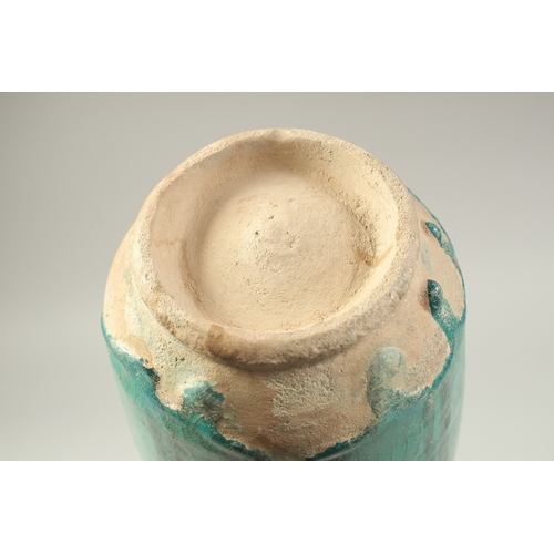 1280 - A PERSIAN KASHAN TURQUOISE GLAZED POTTERY VASE, 24cm high.