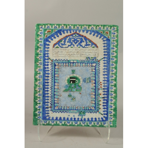 1282 - AN ISLAMIC GLAZED POTTERY TILE DEPICTING MECCA, 33cm x 27cm.