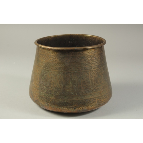 1290 - AN ISLAMIC ENGRAVED BRASS BASIN, 17cm high.