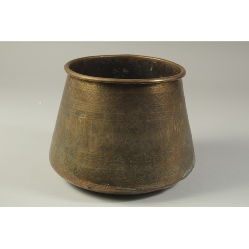 1290 - AN ISLAMIC ENGRAVED BRASS BASIN, 17cm high.