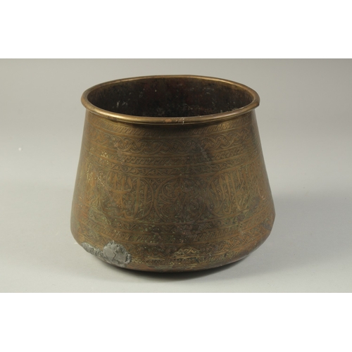 1290 - AN ISLAMIC ENGRAVED BRASS BASIN, 17cm high.