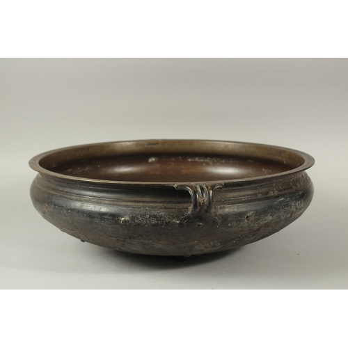 1291 - A LARGE 19TH CENTURY INDIAN OR SOUTH EAST ASIAN BRONZE TWIN HANDLE URLI, 59cm diameter. *Note: a sim... 