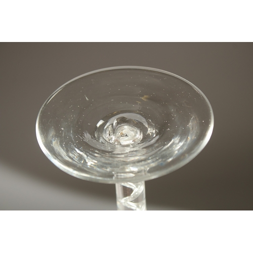 63 - A LARGE GEORGIAN WINE GLASS with plain bowl and air twist stem. 19cms high.