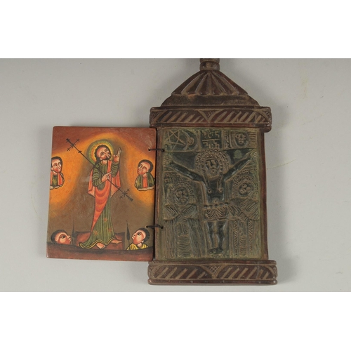 100 - A FINE 19TH CENTURY ETHIOPIAN CARVED WOODEN ICON, the interior with painted panel of Christ, 28cm hi... 