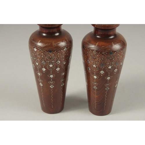 107 - A FINE PAIR OF LATE 19TH CENTURY OTTOMAN TURKISH SILVER INLAID WOODEN VASES, signed and dated to the... 