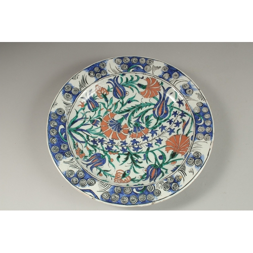 111 - A FINE EUROPEAN POSSIBLY FRENCH IZNIK STYLE PLATE, signed Jeanne, dated 1912, 32cm diameter.