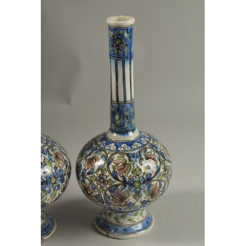 112 - A FINE PAIR OF 19TH CENTURY PERSIAN QAJAR GLAZED POTTERY BOTTLE VASES, 32cm high.