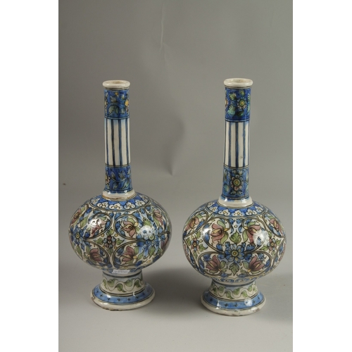 112 - A FINE PAIR OF 19TH CENTURY PERSIAN QAJAR GLAZED POTTERY BOTTLE VASES, 32cm high.