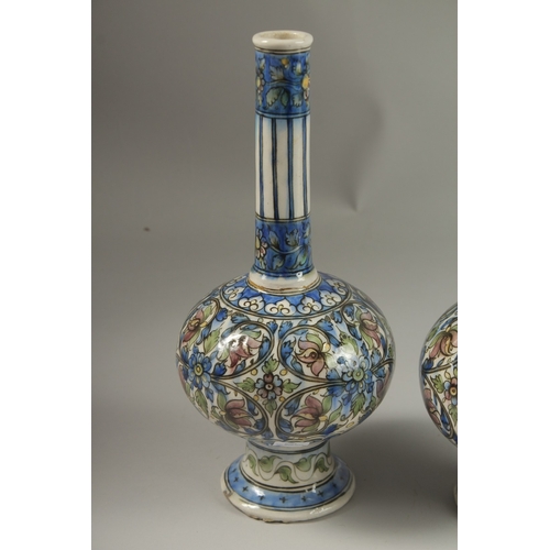 112 - A FINE PAIR OF 19TH CENTURY PERSIAN QAJAR GLAZED POTTERY BOTTLE VASES, 32cm high.