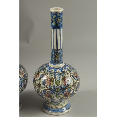 112 - A FINE PAIR OF 19TH CENTURY PERSIAN QAJAR GLAZED POTTERY BOTTLE VASES, 32cm high.