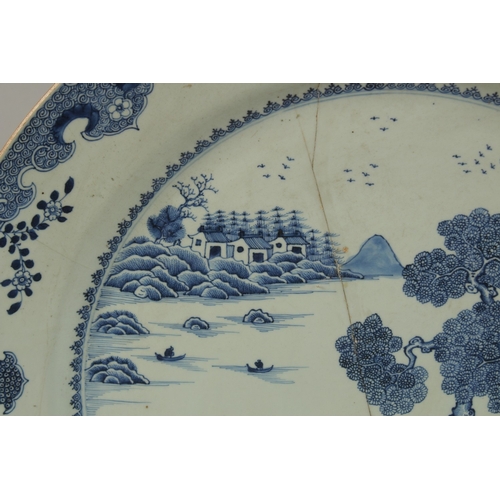 12 - A VERY LARGE CHINESE BLUE AND WHITE PORCELAIN CHARGER, (af), 55cm diameter.