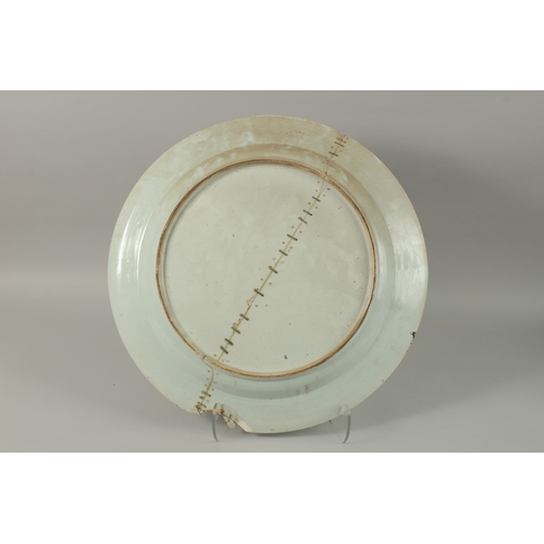 12 - A VERY LARGE CHINESE BLUE AND WHITE PORCELAIN CHARGER, (af), 55cm diameter.