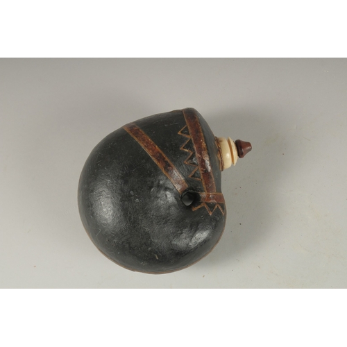 120 - A FINE 18TH-19TH CENTURY MUGHAL INDIAN LEATHER MOUNTED POWDER FLASK, 16cm high.