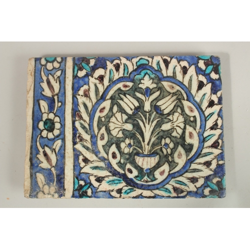 126 - A FINE LARGE 17TH CENTURY OTTOMAN DAMASCUS GLAZED POTTERY TILE, with central floral panel, 27.5cm x ... 