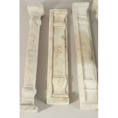 129 - A COLLECTION OF SEVEN ISLAMIC MAMLUK STYLE CARVED MARBLE PILLARS, some with Mamluk cup symbols, (7).