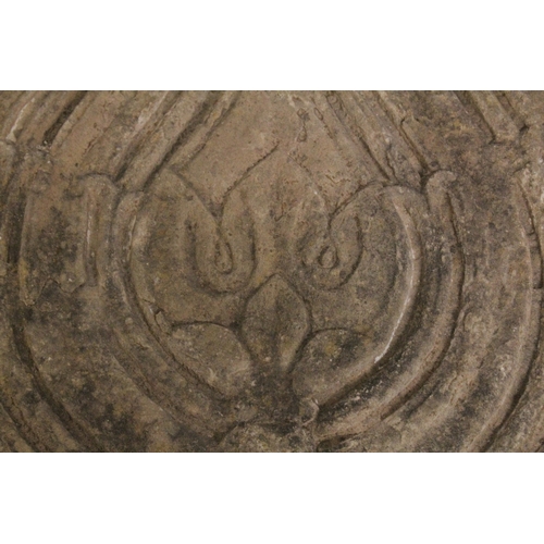 132 - A LARGE 17TH CENTURY INDIAN DECCANI CARVED STONE PANEL, depicting a lotus flower, 59cm x 49cm.