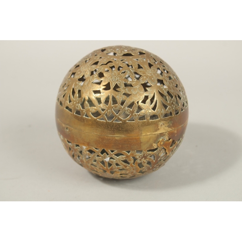 135 - A FINE EARLY 19TH CENTURY MUGHAL NORTH INDIAN OPENWORKED BRASS HAND WARMER, with birds and flower de... 