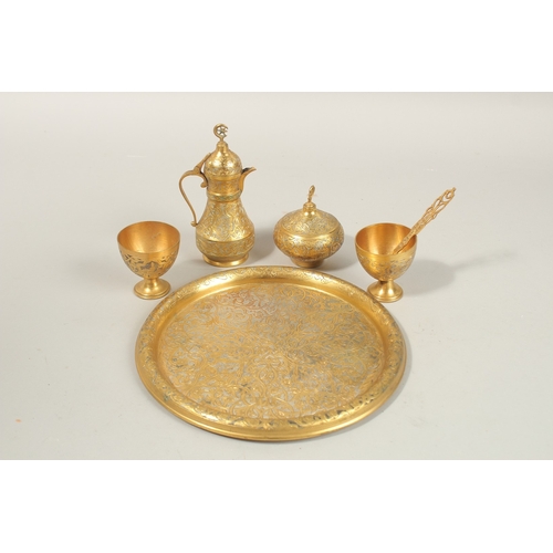 136 - A FINE 19TH-20TH CENTURY OTTOMAN TURKISH GILT COPPER TOMBAK COFFEE SET, tray 21cm diameter.