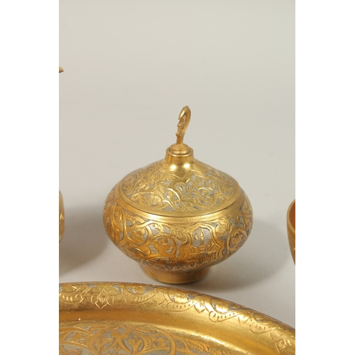 136 - A FINE 19TH-20TH CENTURY OTTOMAN TURKISH GILT COPPER TOMBAK COFFEE SET, tray 21cm diameter.