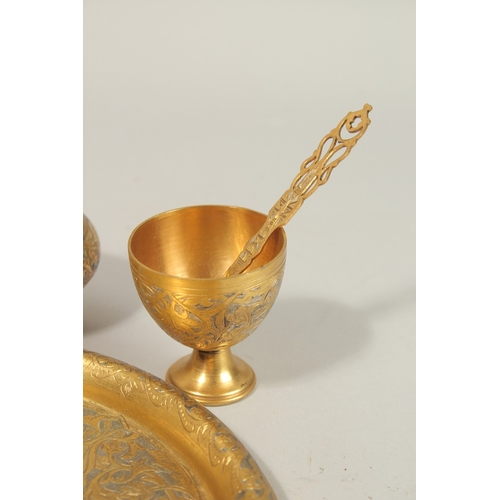 136 - A FINE 19TH-20TH CENTURY OTTOMAN TURKISH GILT COPPER TOMBAK COFFEE SET, tray 21cm diameter.