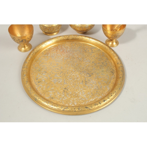 136 - A FINE 19TH-20TH CENTURY OTTOMAN TURKISH GILT COPPER TOMBAK COFFEE SET, tray 21cm diameter.