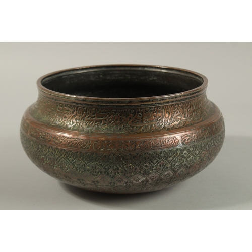 146 - A FINE 17TH-18TH CENTURY PERSIAN SAFAVID ENGRAVED TINNED COPPER BOWL, with two rows of very fine cal... 