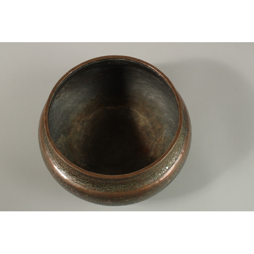 146 - A FINE 17TH-18TH CENTURY PERSIAN SAFAVID ENGRAVED TINNED COPPER BOWL, with two rows of very fine cal... 