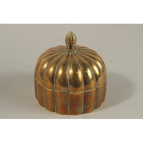 149 - A 19TH CENTURY MUGHAL INDIAN DOMED BRASS PANDAN BOX, 12cm high.