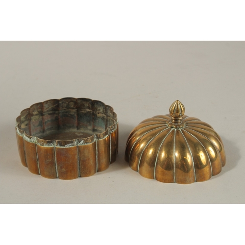 149 - A 19TH CENTURY MUGHAL INDIAN DOMED BRASS PANDAN BOX, 12cm high.