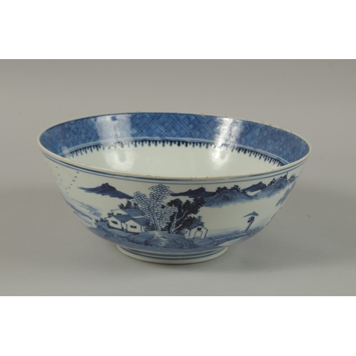 15 - A CHINESE BLUE AND WHITE PORCELAIN BOWL, with four-character mark, 26cm diameter.