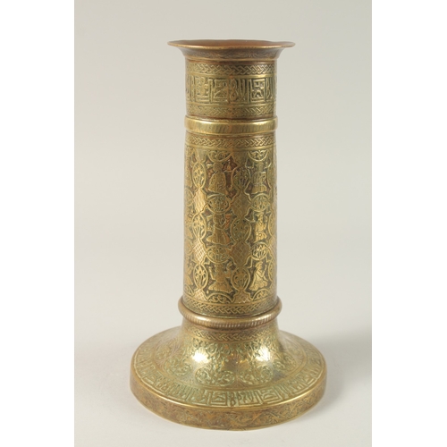 154 - A FINE 19TH CENTURY PERSIAN BRASS CANDLESTICK WITH SILVER INLAYS, the body engraved with seated figu... 