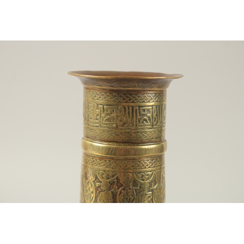 154 - A FINE 19TH CENTURY PERSIAN BRASS CANDLESTICK WITH SILVER INLAYS, the body engraved with seated figu... 