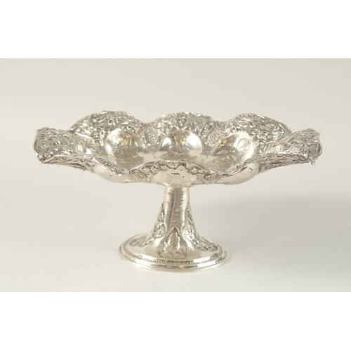 155 - A PERSIAN ENGRAVED AND CHASED SOLID SILVER FOOTED CENTREPIECE, with detachable stand, the bowl engra... 