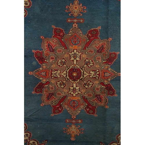 156 - A PERSIAN BLUE GROUND AND RED DESIGN RUG, 180cm x 122cm.