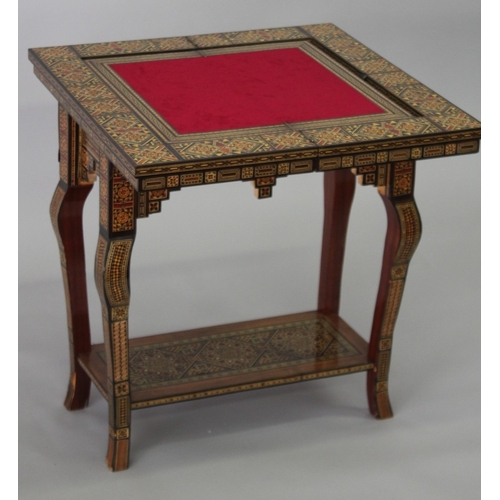 166 - A MOROCCAN MARQUETRY INLAID FOLDING GAMES TABLE, with open-out inset top and folding out leg.