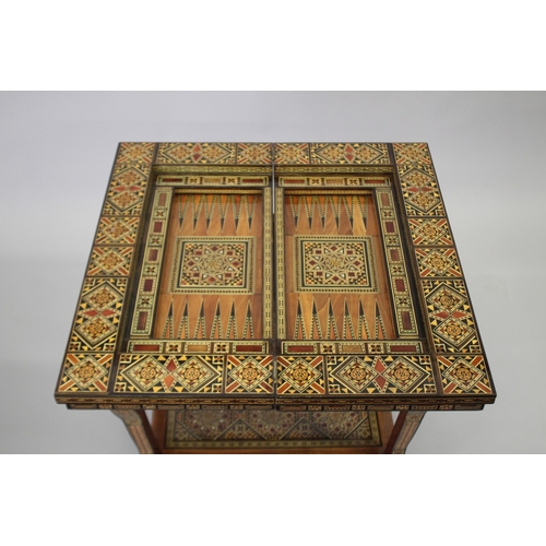 166 - A MOROCCAN MARQUETRY INLAID FOLDING GAMES TABLE, with open-out inset top and folding out leg.