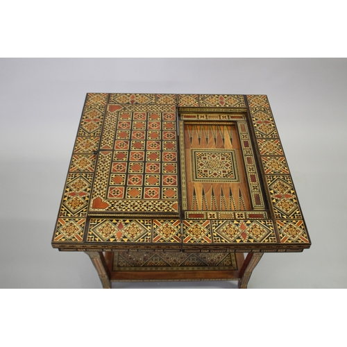 166 - A MOROCCAN MARQUETRY INLAID FOLDING GAMES TABLE, with open-out inset top and folding out leg.