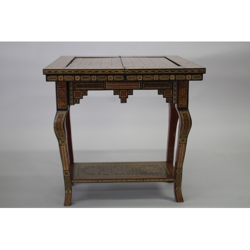 166 - A MOROCCAN MARQUETRY INLAID FOLDING GAMES TABLE, with open-out inset top and folding out leg.